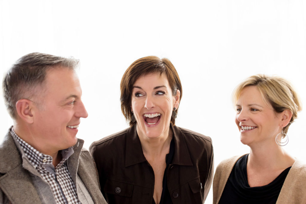 Milwaukee Realtor team candidly laughing together| Photo by Front Room